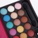 A set of decorative cosmetics: eye shadows, eyebrow shadows, lip gloss, blush, mirror