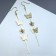 Hanging earrings "Butterflies and flowers", white color in gold, 10 cm