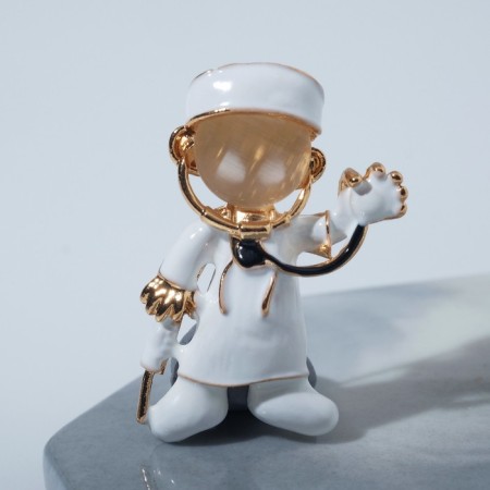 Brooch "Doctor" with a phonondoscope, white color in gold