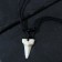 Pendex “fang” fragment, white color on a black lace, 42 cm