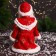 Santa Claus "In a fur coat with folding sleeves and a staff" 30 cm, moves, red