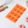 The form for baking the share "German cupcake. Openwork ", silicone, 12 cells, 28 × 16 × 1.5 cm, orange color