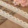 Knitted lace, 25 mm × 15 ± 1 m, beige color