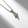 Lightning pendant, silver-gold color, 70 cm