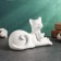 The figure "cats lie" white, 18x10x12cm