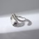 The ring "curls" bends, the color is silver, dimensionless
