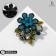 Brooch "Flower" with curls, sea color in ferrous metal