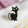 Brooch "Cat" shy, black color in gold
