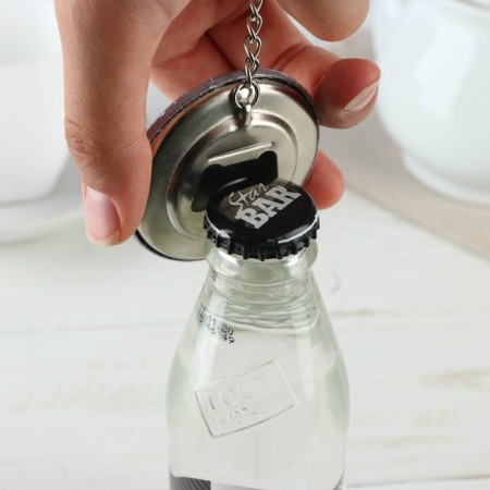 A keychain opener for keys "invincible", diam. 5.8 cm-3