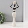 Polystone souvenir "African with a wicker round jug" white 10x6x28 cm