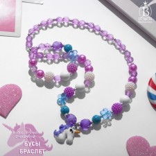 Children's “chosen” set 2 objects: beads, bracelet, unicorn in flowers, color mix