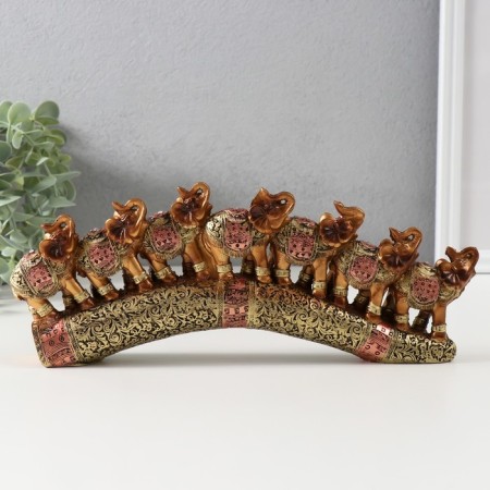 Souvenir Polystone "Seven African elephants in the gold, openwork blanket" 10.7x29x4 cm