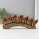 Souvenir Polystone "Seven African elephants in the gold, openwork blanket" 10.7x29x4 cm