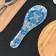 Glass stand under a spoonful of the Sineva, 23.5 × 8.3 cm