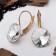 Earrings with rhinestones "Bright classic", white color in gold, d = 1.4 cm