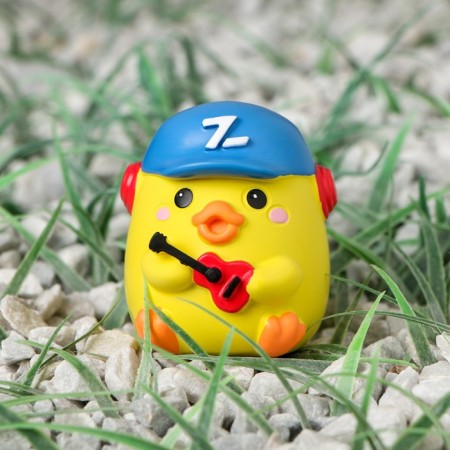 Duckling on the car panel, guitarist, yellow