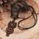 A pendant on the lace "Filin", the color is brown-black on a black lace, 80 cm