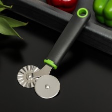 A knife for pizza and dough is a double-sided lime, 17 × 7.5 cm, black and green color