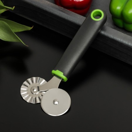 A knife for pizza and dough is a double-sided lime, 17 × 7.5 cm, black and green color