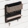 The keybox is wall -mounted with a shelf with a shelf and a “happiness” pocket, 20 x 20 cm.