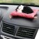 Toy on a car panel, a cat on a pillow, black and white color