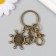 Keychain metal with carbine "anchor and storm" bronze 7 cm