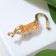 Brooch "Cat" grace, matte white color in gold
