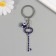 Keychain from the evil eye Metal "key with pebbles" 2.4x6.5 cm
