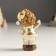 Polystone souvenir "Baby in a gold caftan and cap, with a bird/gift" Mix 4x5x10 cm 94988