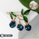 Berry brooch, blue-green color in gold