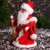 Santa Claus "In a fur coat with folding sleeves and a staff" 30 cm, moves, red
