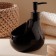 A soap dispenser with a Savanna drop sponge stand, 450 ml, black color