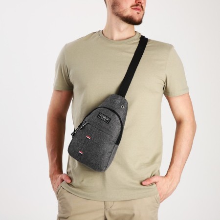 Male sling bag from textiles, headphone opening, gray color