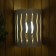 A wooden lampshade, semicircular "flame"