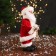 Santa Claus "with bells and with a flashlight on the staff" 30 cm, moves, red-white