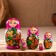 Matryoshka "God's cow", purple scarf, 5 puppet, 9-11 cm