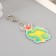 Acryl keychain "Snake in a cap with horns with a gift" 5.5x5.2 cm