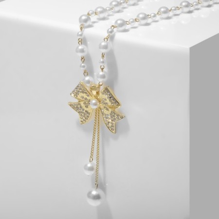 Pearl with pearls "bow" large, white color in gold, 70 cm