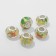 Bead "birds with flowers", yellow color in silver