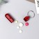 Tabalney keychain Pill Box, red, 1.4 x 5.2 cm.