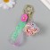 A plastic keychain with a carbine, a strap "Flying Bandage" Water with decor1.8x5.3x5.6 cm