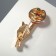 Brooch "Gesture", red-white color in gold