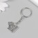 Metal keychain "Pesik with chamomile" 1.9x2.5 cm