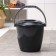 A bucket with a “successful one” lid, 10 l, the color is black