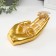 Standing interior polystone "Bird in the palm" gold 19.5x9.3x9.5 cm