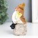 Polystone souvenir "Dwarf in an orange cap on a stone" 11x6.2x5.7 cm