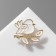 Bird icon on a twig, white color in gold