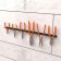 Holder for storing a hand tool with smooth handles, wall, black