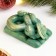 New Year. Symbol 2025. Figure soap "Snake Tourist" Green with gilding