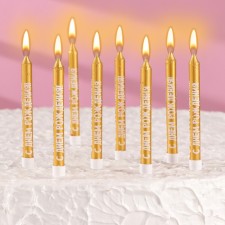 A set of candles for a cake with the inscription 
